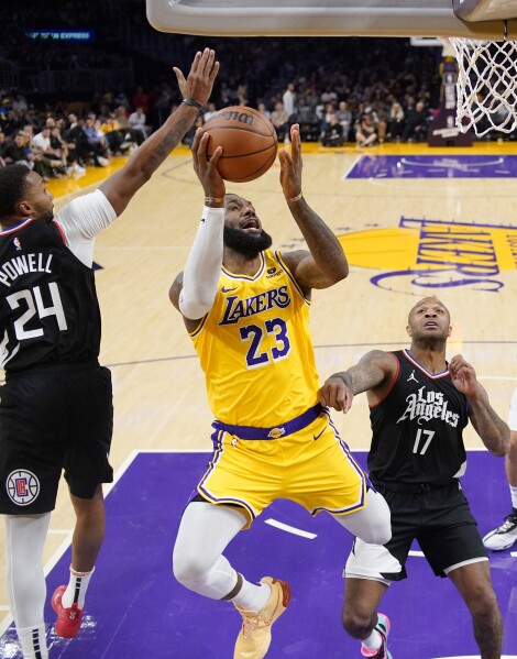 Lakers hold off Clippers 130 125 in OT to snap an 11 game losing